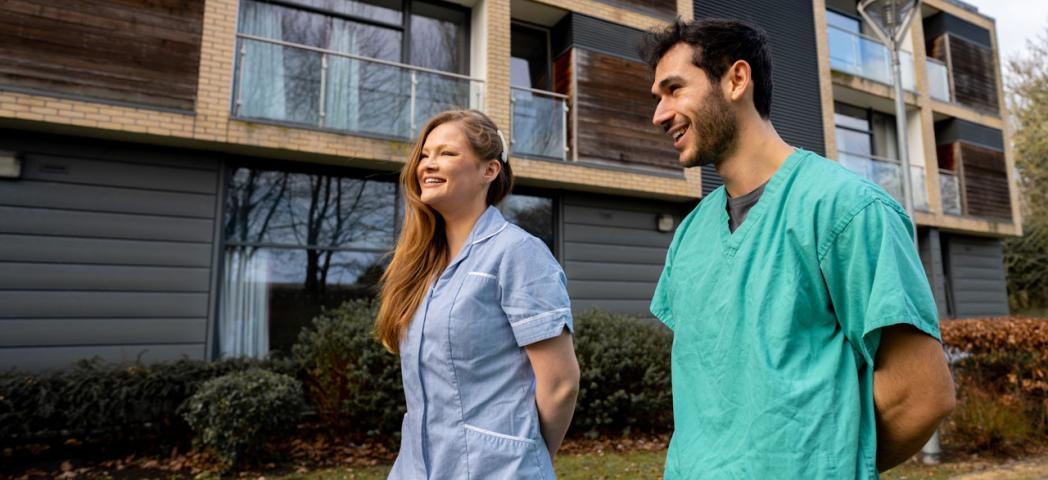 Two Sanctuary keyworkers walking around our Addenbrookes site